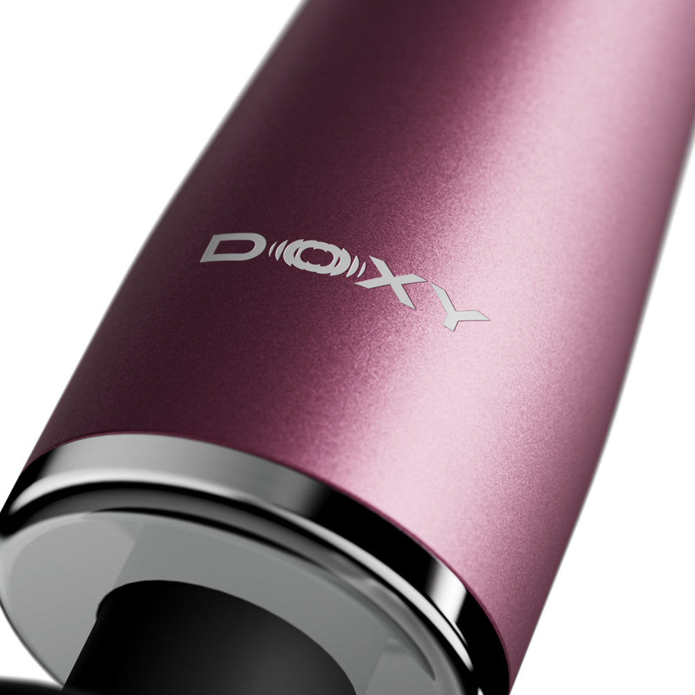 Close-up of the Doxy Go Travel-sized Wand Massager Pink showcasing the product's sleek design and logo.