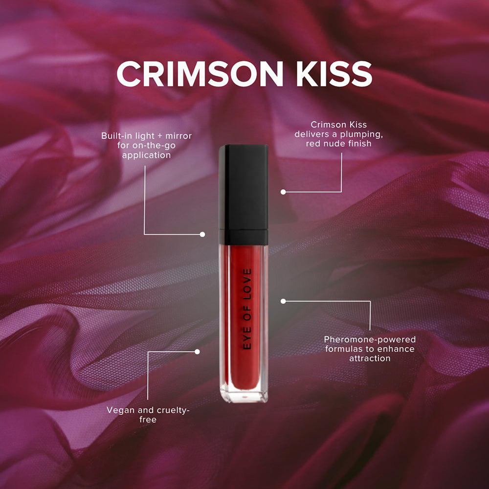 Eye Of Love Matchmaker Pheromone Plumping Lip Gloss Crimson Kiss in a sleek tube on a luxurious background.