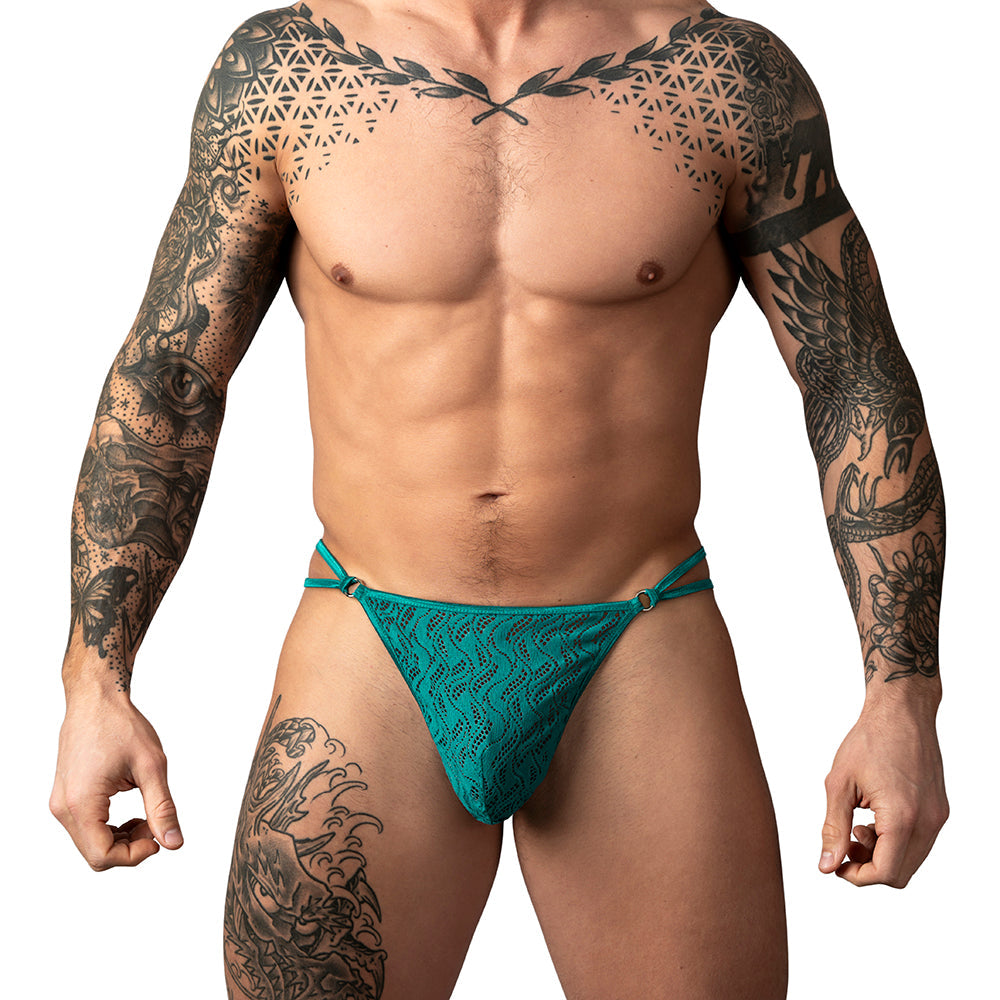 Male Power Ripple Lace Micro V-String Teal S/M worn by a muscular man showcasing its modern lace design.