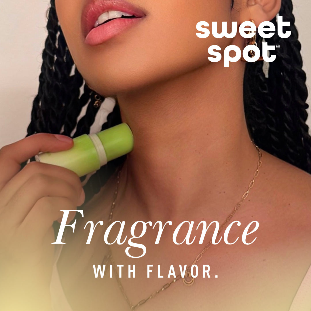 Sweetums Sweet Spot Flavored Fragrance Hibiscus Hottie applied to neck for a fragrant and flavorful experience.