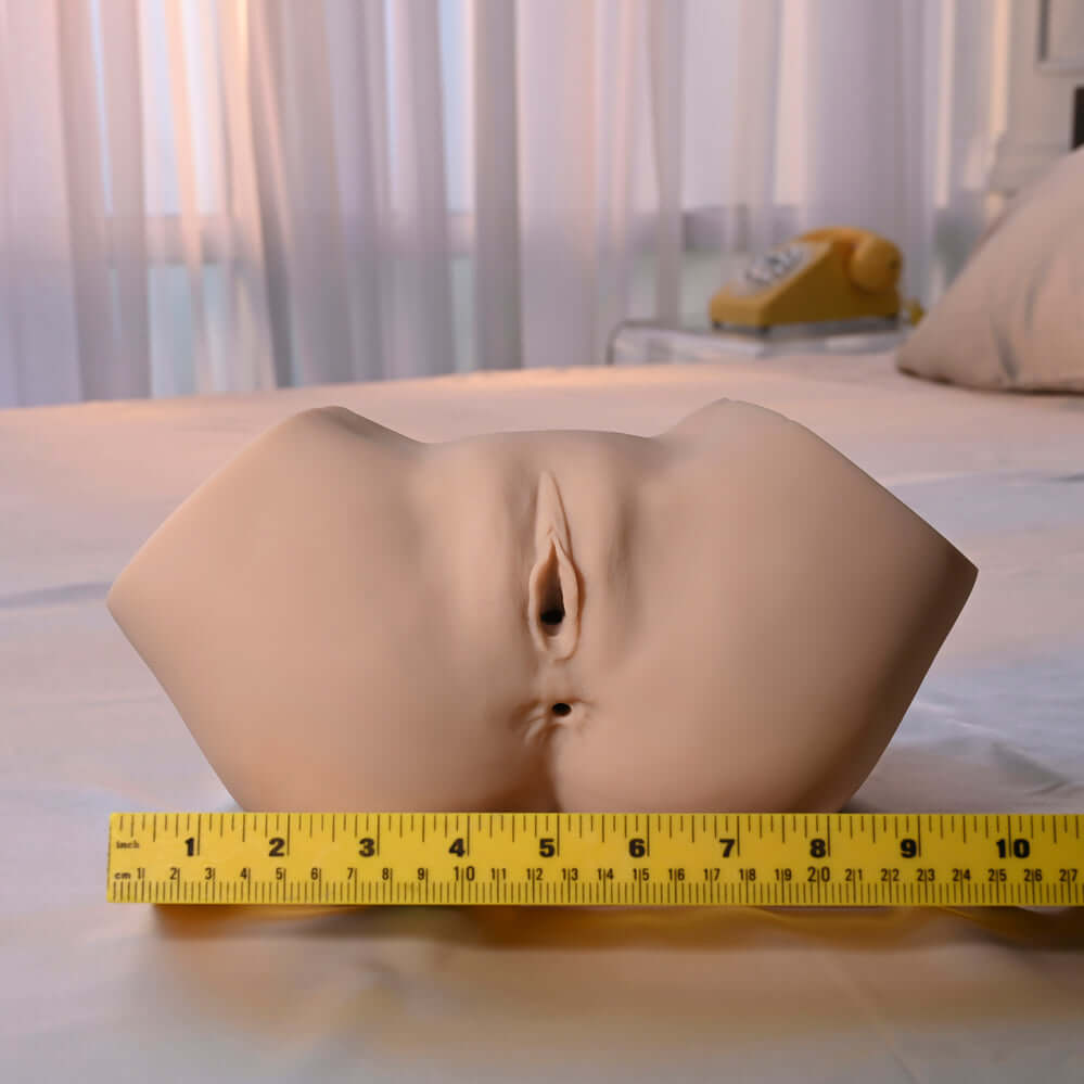 Squirt for Me Sasha Grey Movie & Realistic Squirting Stroker with lifelike design and texture on a measuring tape.