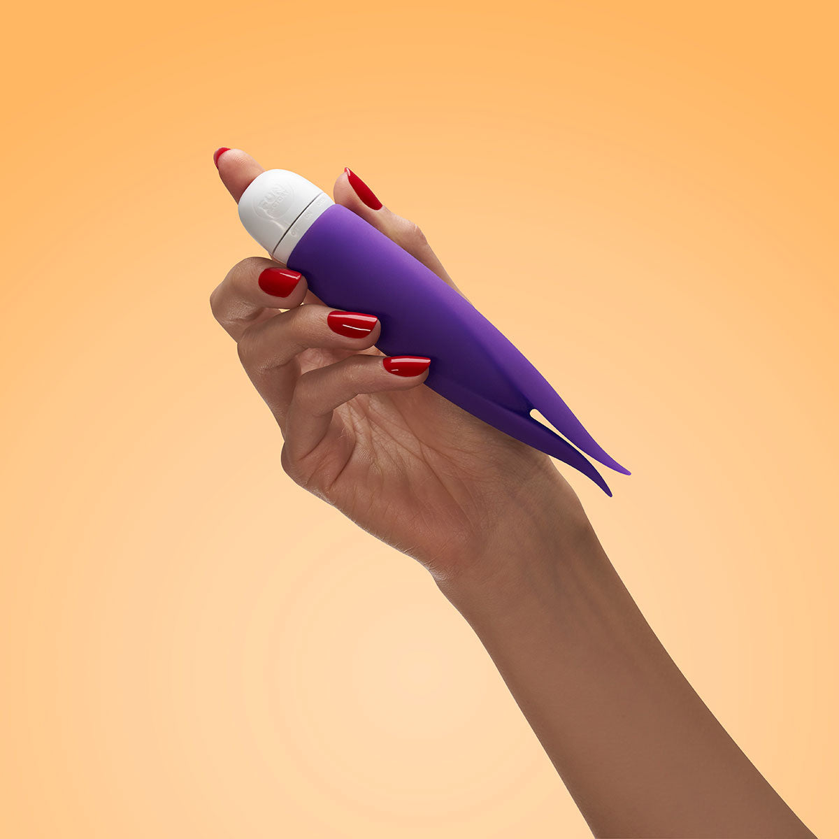 Hand holding the Fun Factory Volita Vibrator Violet against a gradient orange background.