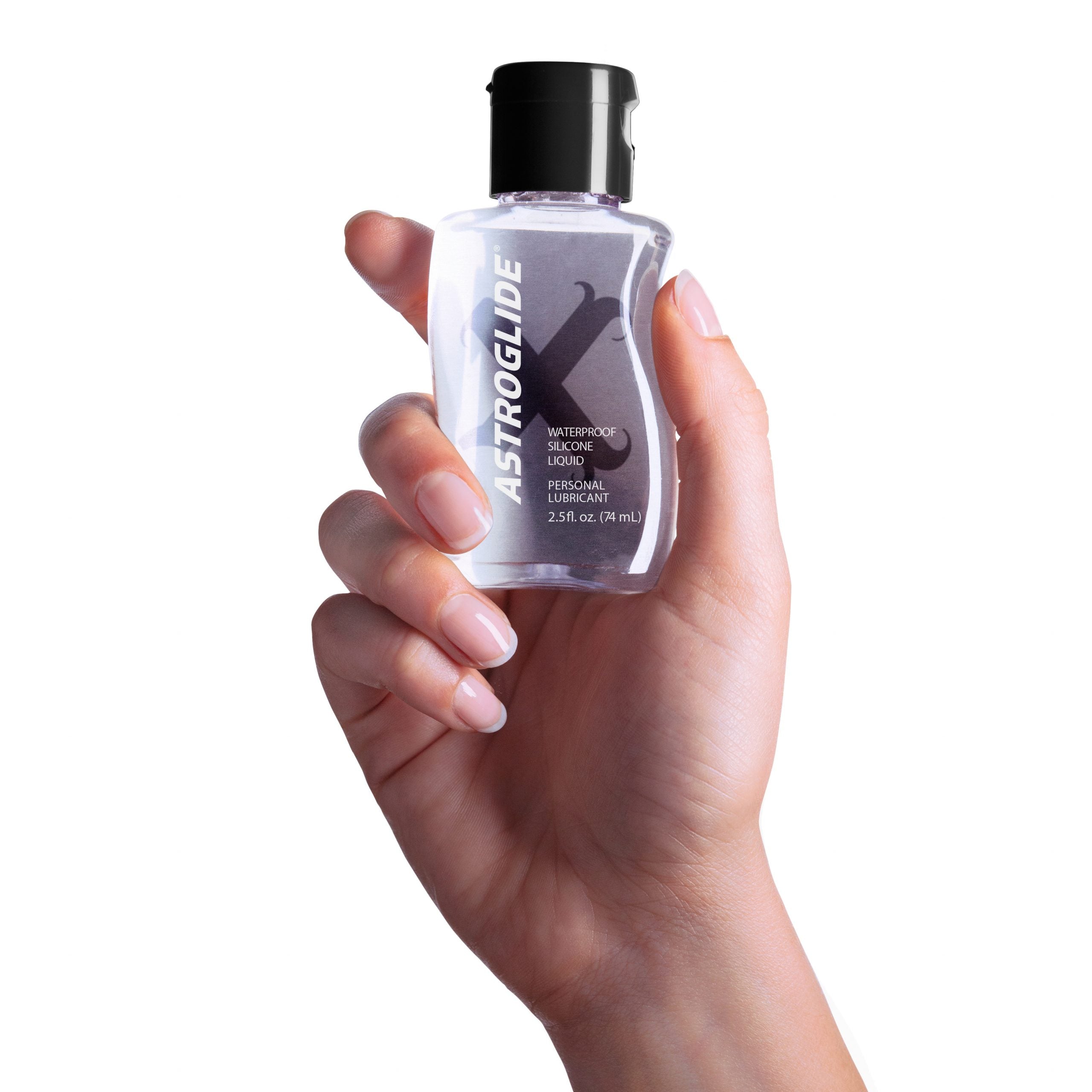 Astroglide X Premium Silicone Lubricant 2.5 Oz held in a hand against a white background.
