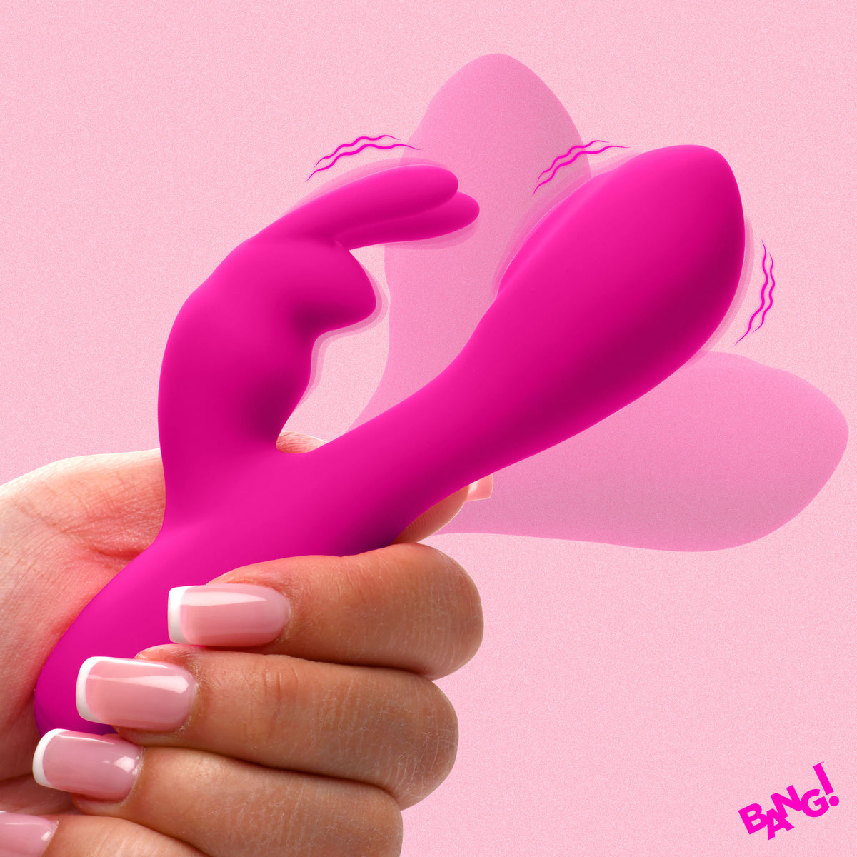 Flexible Vibrating Silicone Mini Rabbit Pink held in hand against a pink background, showcasing its design and features.