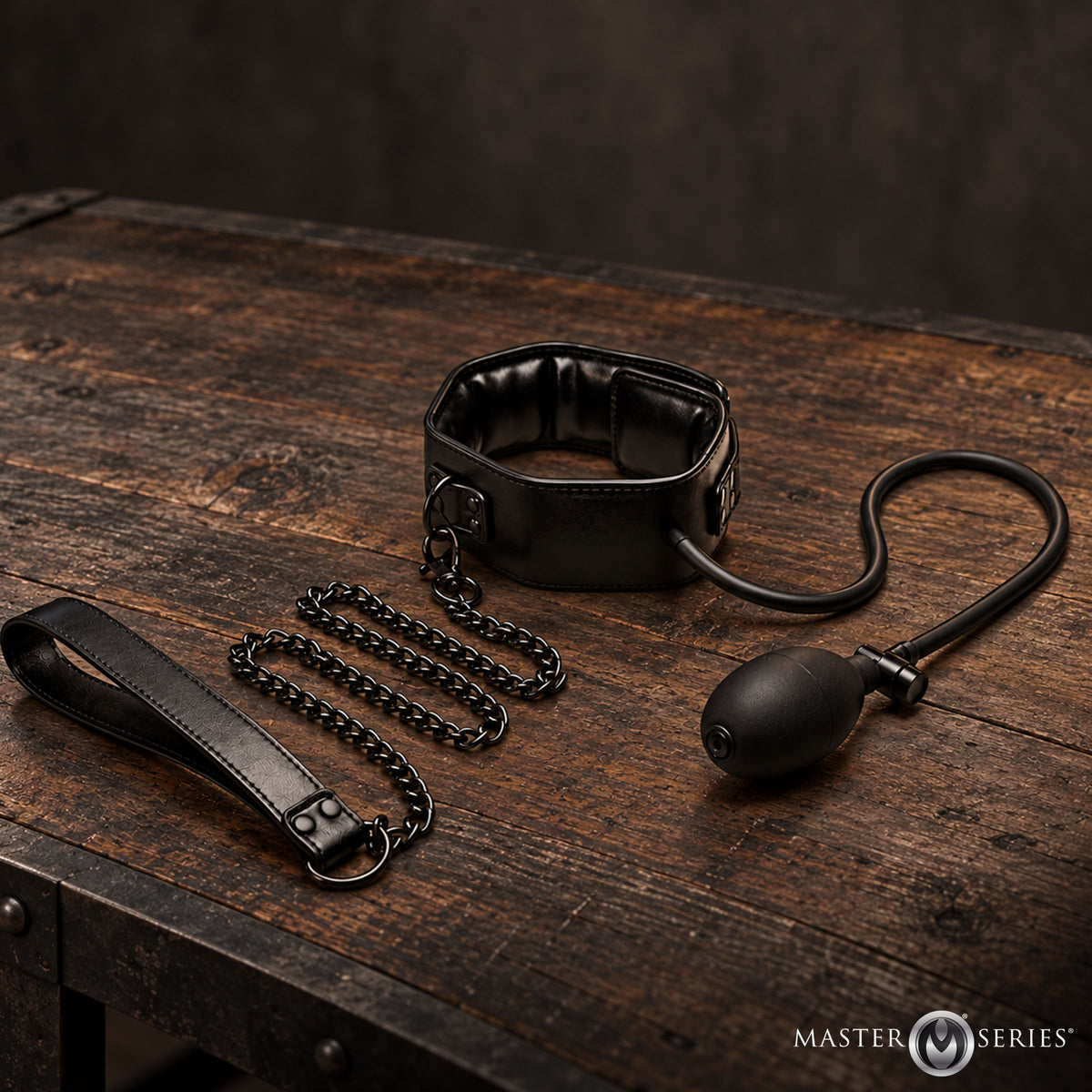 Master Series Constrict Inflatable Collar with Leash Black displayed on a wooden table.
