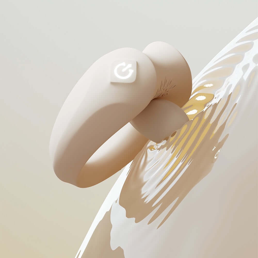 ZALO Apis Vibrating Couples Ring Ivory White displayed against a smooth, water-like background.
