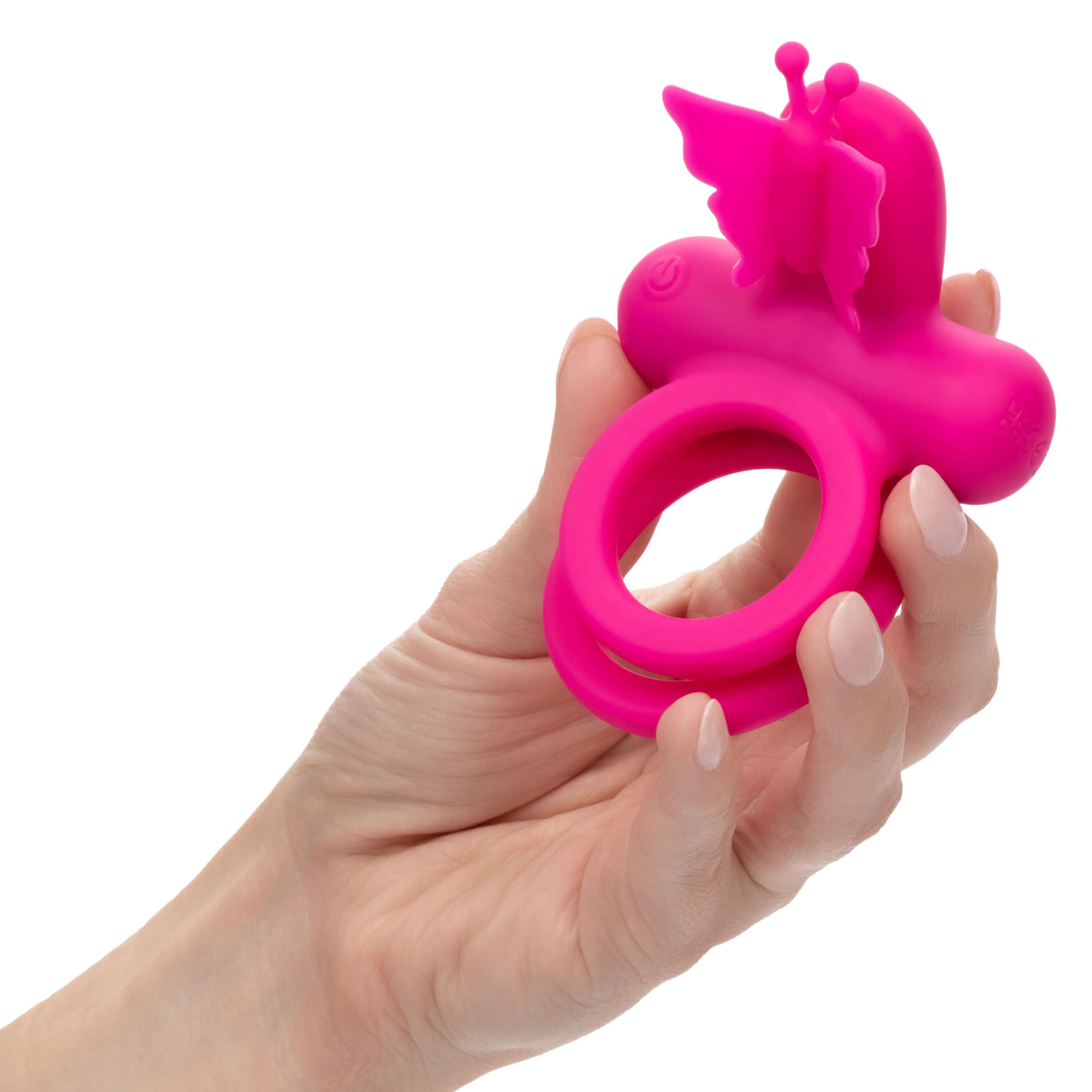 Silicone Rechargeable Dual Butterfly Ring Pink held in a hand, showcasing its design and playful butterfly feature.