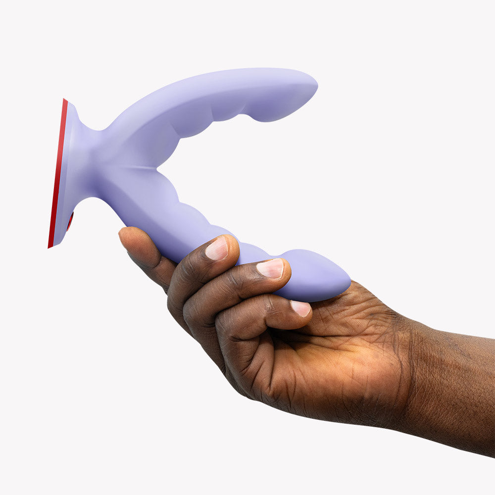 Hand holding Fun Factory Ryde Grinding Dildo Purple showcasing its innovative dual-shaft design and ribbed texture.