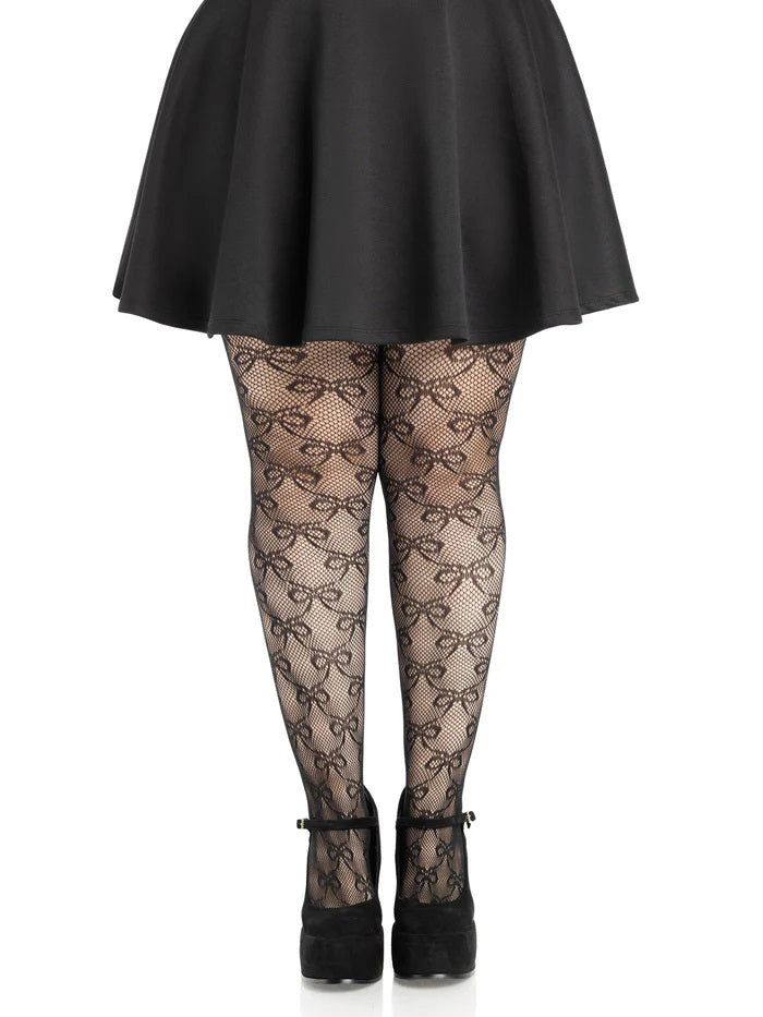 Leg Avenue Plus Size Bow Net Tights 1X 2X Black worn with a black skirt and heels, showcasing the elegant bow net pattern.