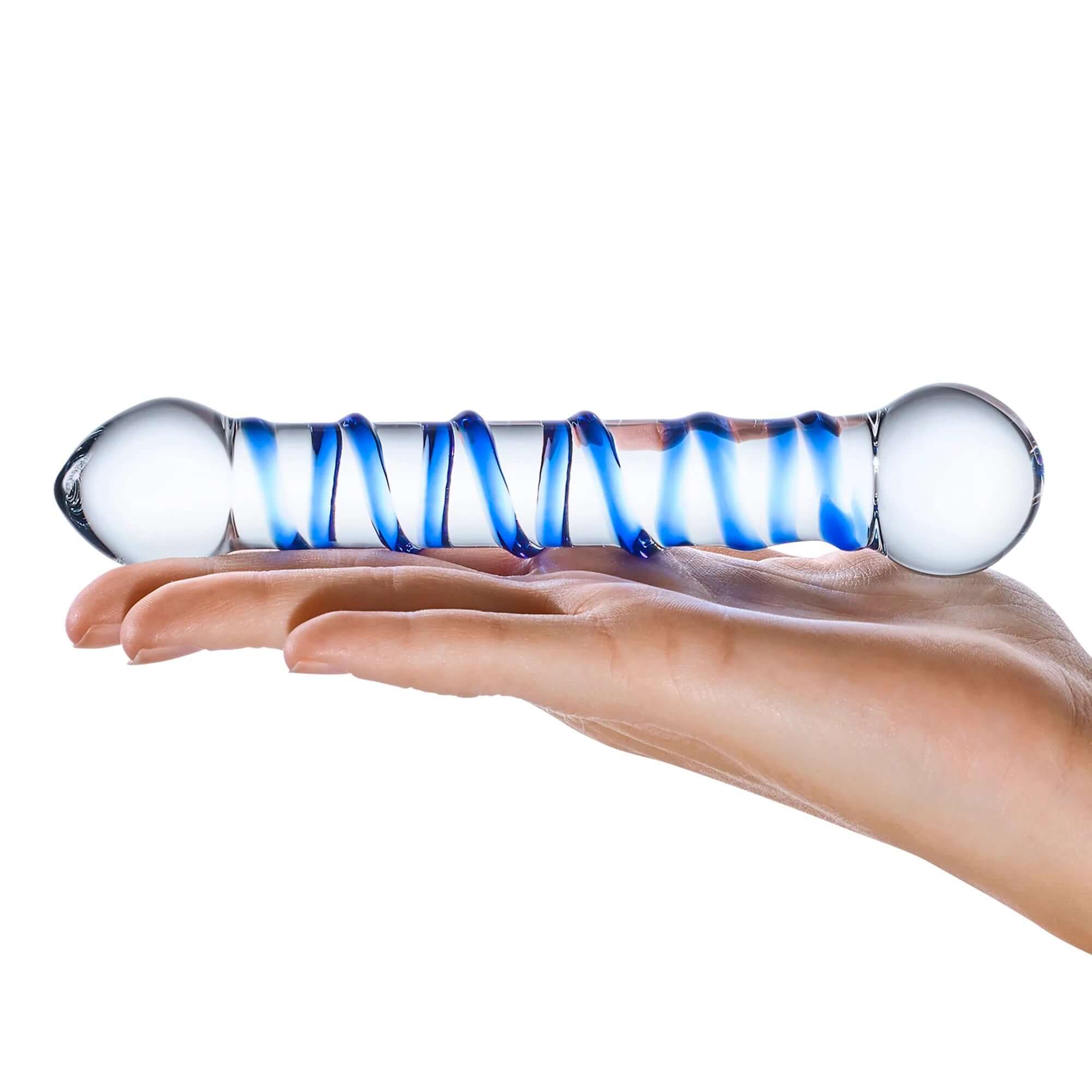 6.5 Inch Spiral Glass Dildo with raised glass spiral held in hand, featuring a smooth teardrop-shaped tip and bulb on the other end