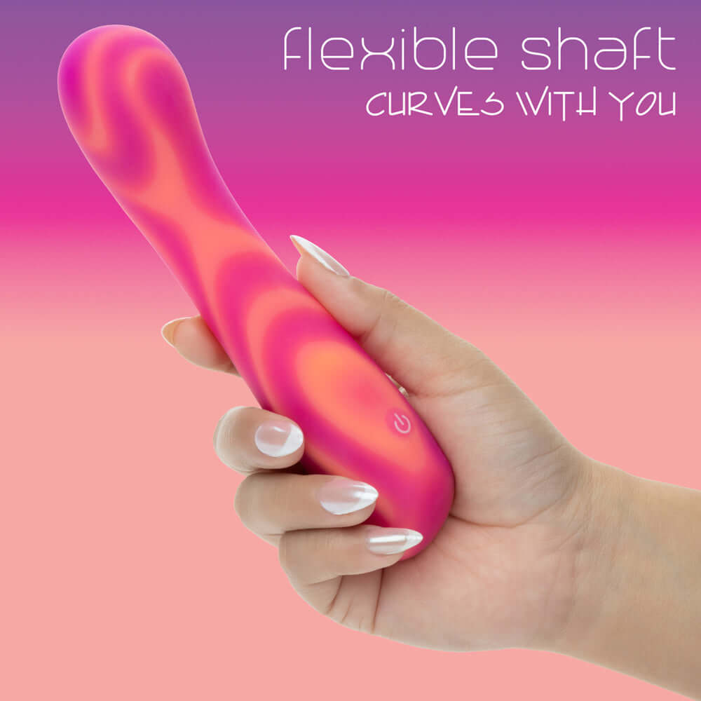 User holding the Endless Summer Sunset Seducer Massager Pink featuring a flexible shaft designed for versatility.