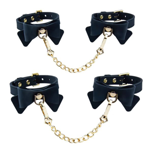Temptasia Ardor Wrist & Ankle Restraints Black With Bow featuring stylish black silicone design and gold chain.