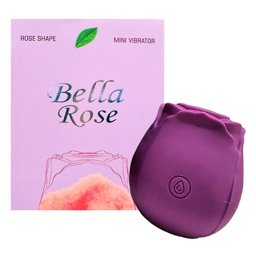 Bella Rose Purple Silicone Clitoral Vibrator in rose shape packaging with pink background.