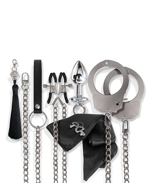 Nixie Interchangeable 8 pc Bondage Kit Silver with various accessories including restraints, clamps, and a leash.