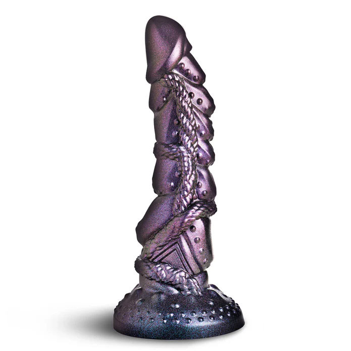 Creature Cocks Ilias Elf Silicone Dildo displayed in shimmering purple with intricate sculpting and a sturdy base.