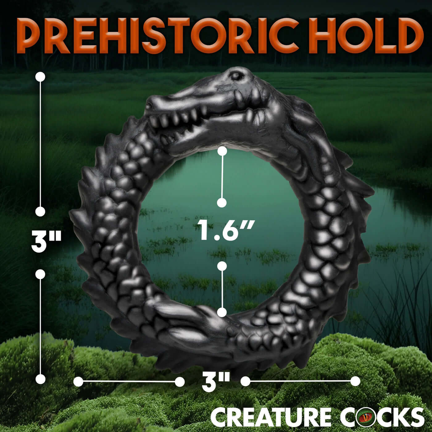 Black Caiman Silicone Cock Ring with dimensions 3" x 3" outer and 1.6" inner diameter, ridged texture and grinning caiman design in lush green background.