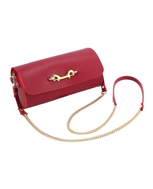 Kinky Play Box Federico Luxurious Leather Restraint Kit Red displayed with a fashionable red bag featuring a chain strap.