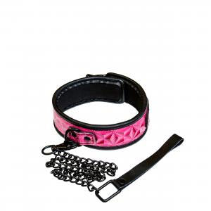 Sinful Collar Pink NS Novelties featuring bold pink vinyl and chain accents for stylish adventurous play.