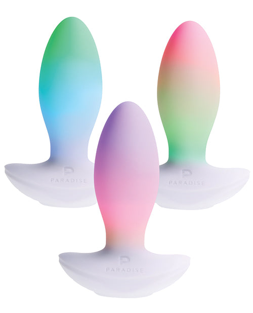 Illumination THE Plug Vibrator White in three vibrant colors with customizable LED features.
