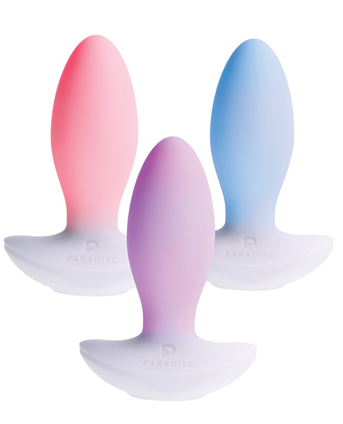 Illumination THE Plug Vibrator White in pink, lavender, and blue, showcasing customizable LED illumination.