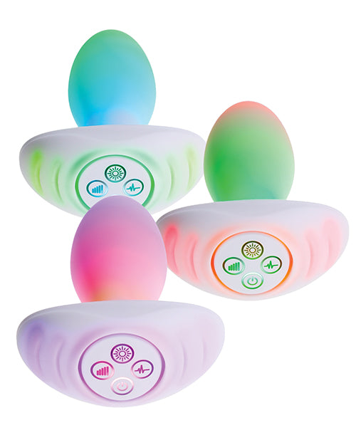 Illumination THE Plug Vibrator White shown with customizable LED lights and control interface.