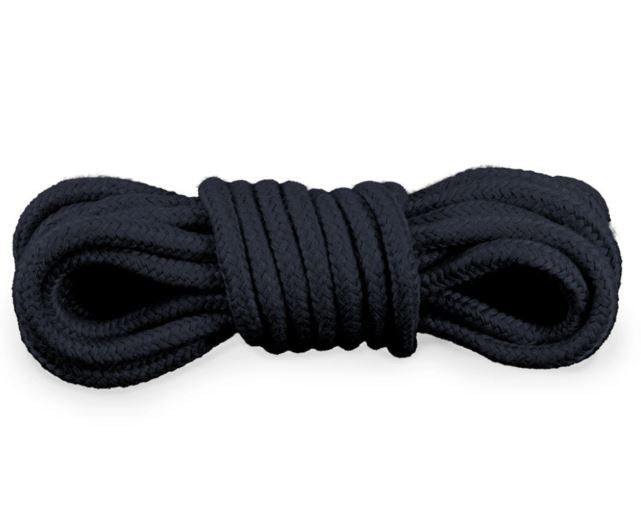 Kink Curious Bondage Rope Black coiled and ready for restraint play in the bedroom.