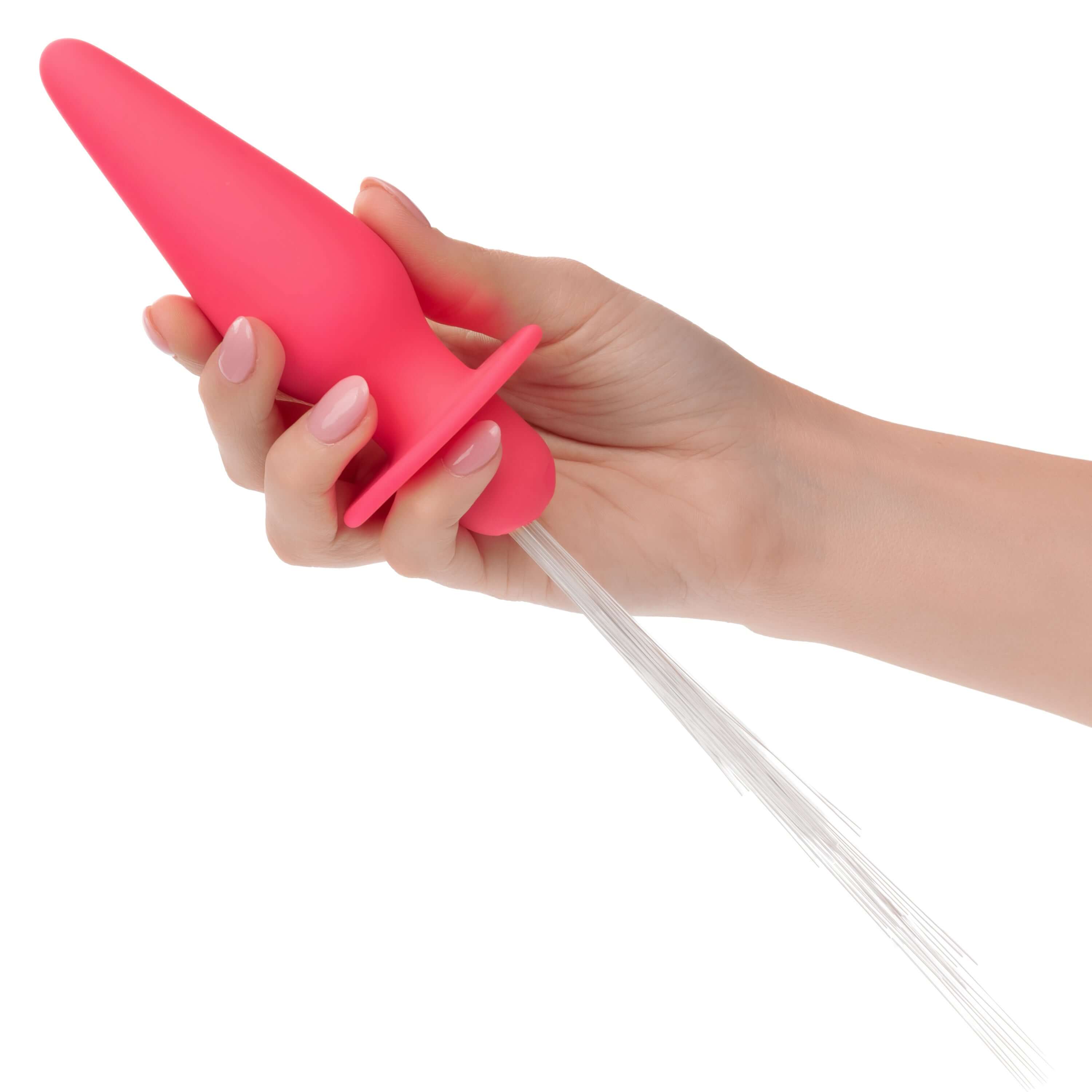 Hand holding a pink Southern Lights Vibrating Light Up Anal Probe with shimmering light fibers attached.