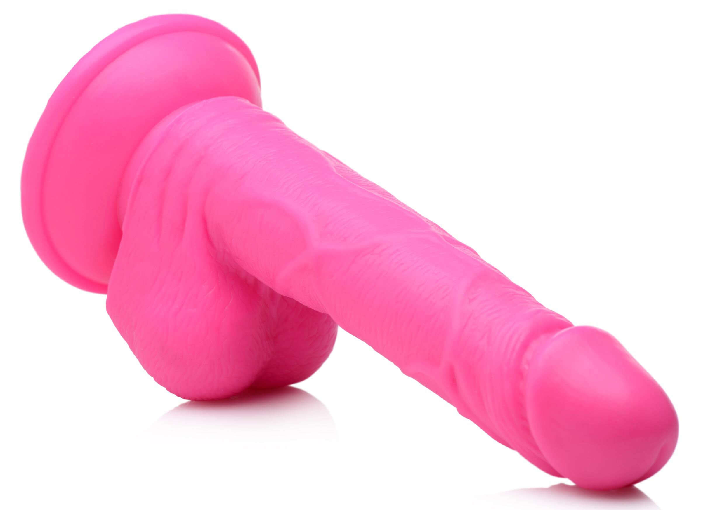 Pop Pecker 6.5 Inch Dildo With Balls Pink displayed at an angle showing veins and balls for realistic appearance.