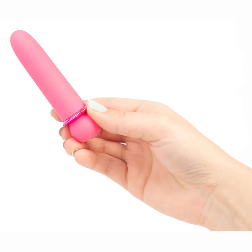 Pink Jaguar vibrating bullet with silicone coating held in hand, showcasing its 10 functions, 5 speeds, and 5 patterns.