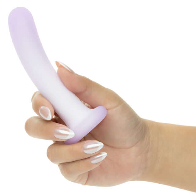 Hand holding Lavender Haze Slender Curved Probe Purple for targeted stimulation.