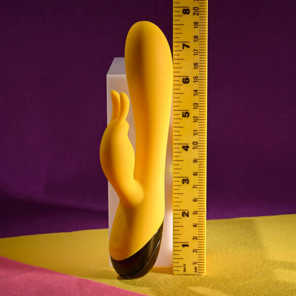 Selopa Buzzz Bunny Rechargeable silicone rabbit vibrator in yellow, showcasing its dimensions and features.