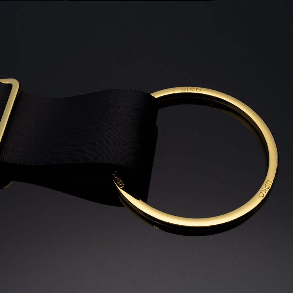 UPKO black bondage strap with gold alloy ring detail, perfect for BDSM wrist restraints and versatile restraint applications.
