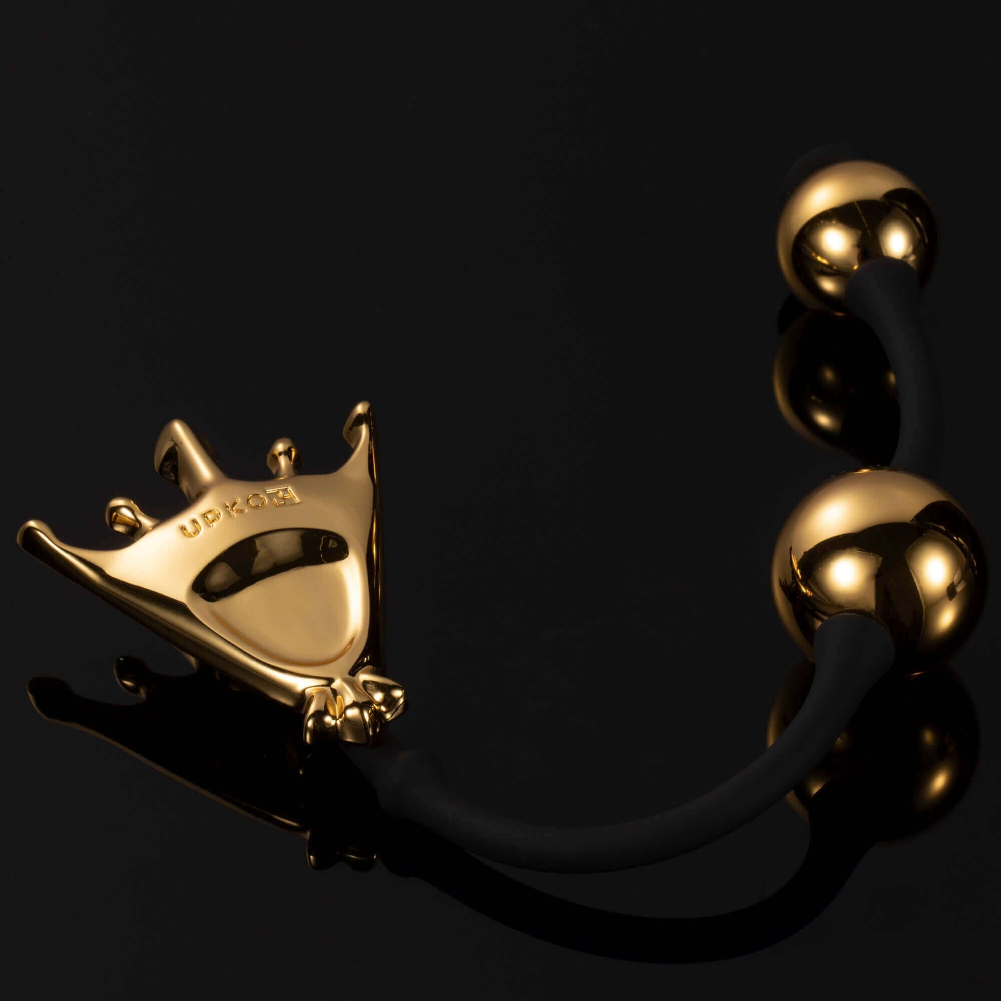 "Queen Premium Metal Pleasure Balls from The Chess Collection with luxurious gold finish and ergonomic design for Kegel exercises."