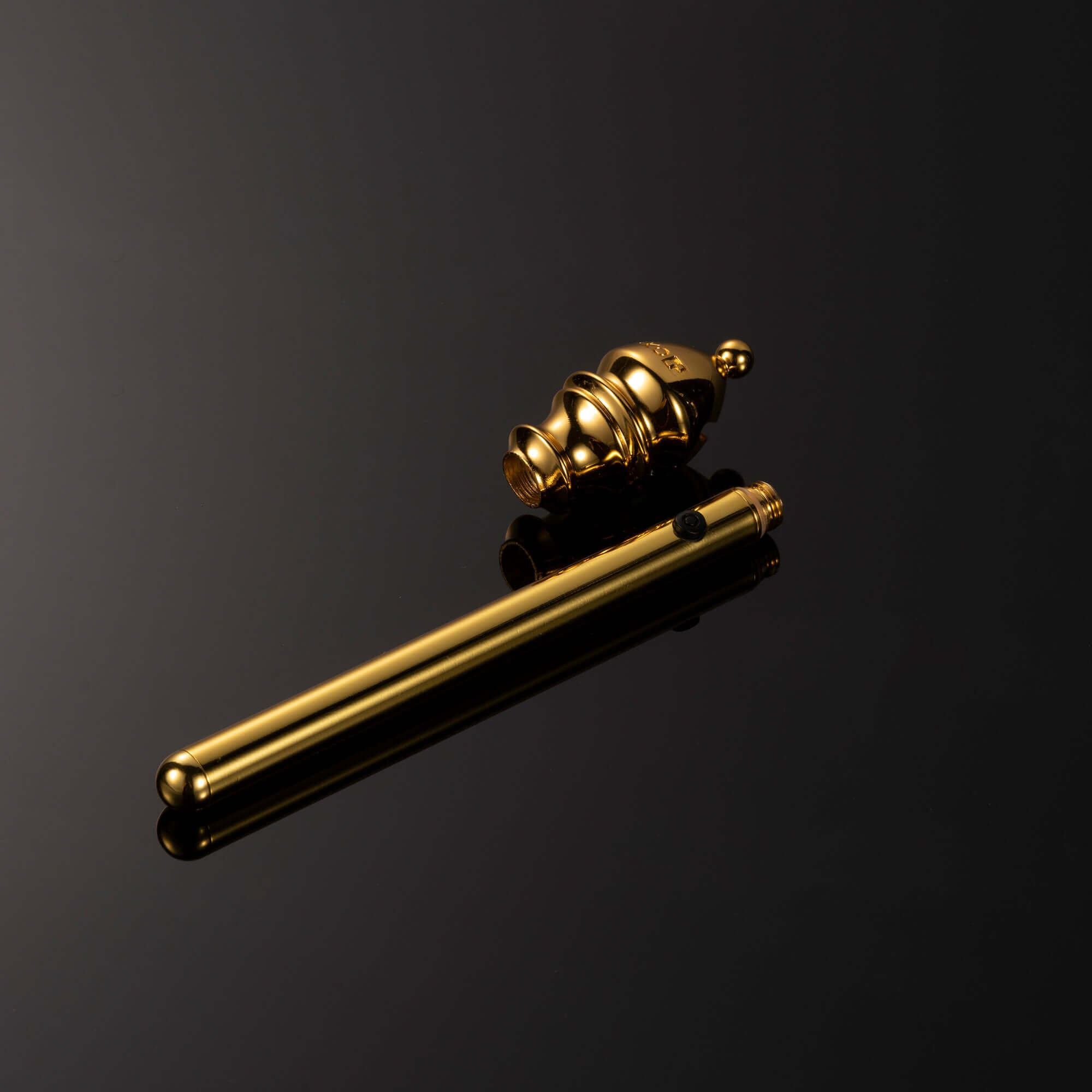 Gold mini vibrator from "The Chess" Collection - Bishop, sleek design with compact portability and smooth finish.