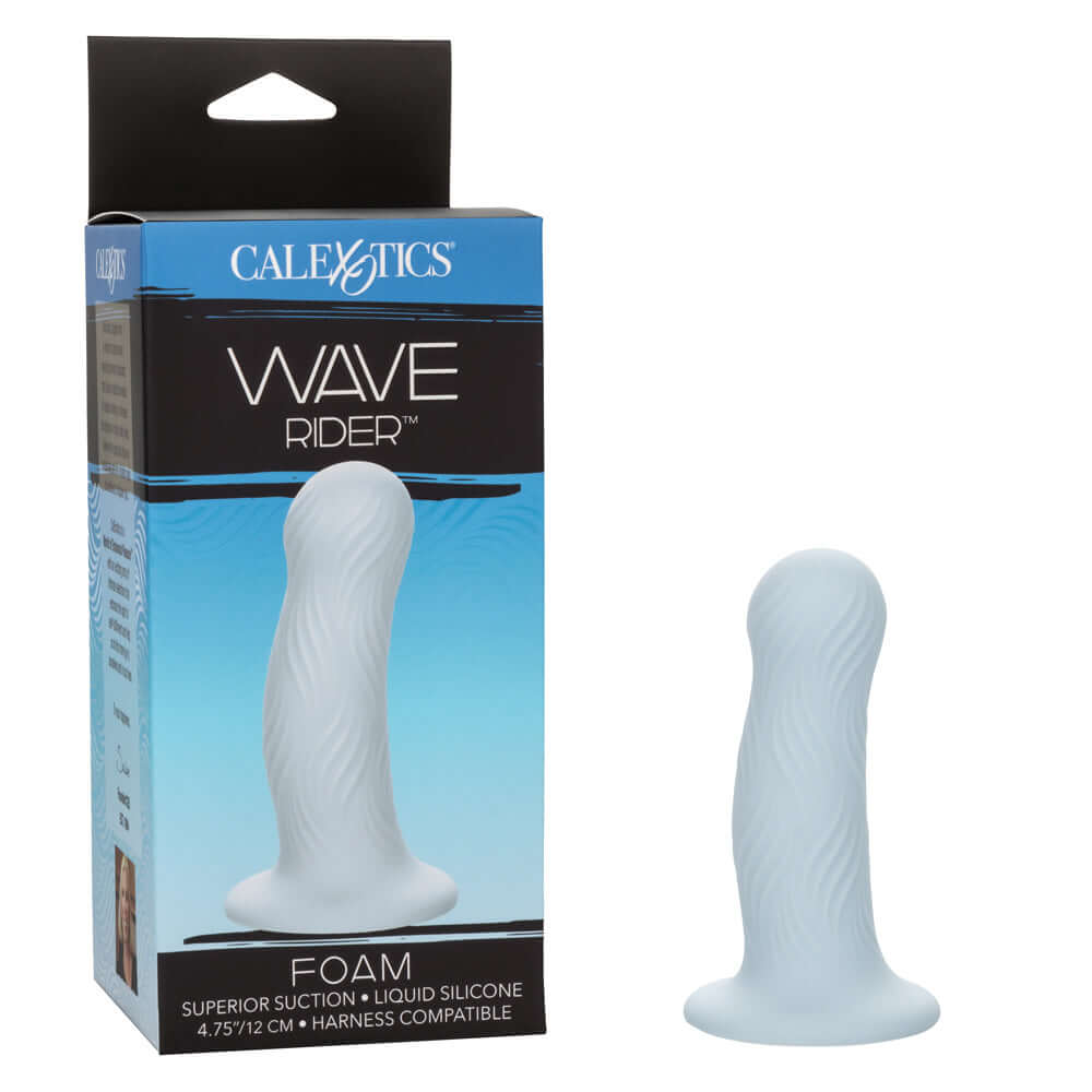 Wave Rider Foam Dildo - Blue with wavy texture and bulbous shape next to packaging.