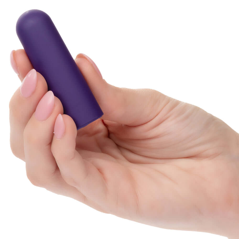 Hand holding purple Turbo Buzz Rounded Mini Bullet stimulator