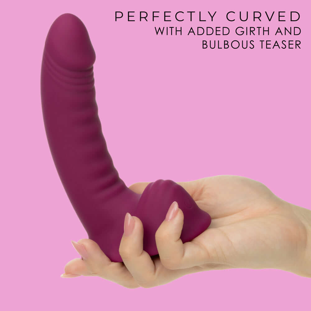 G-Ride Road Trip Liquid Silicone Vibrator held in hand showcasing its perfect curve and added girth.