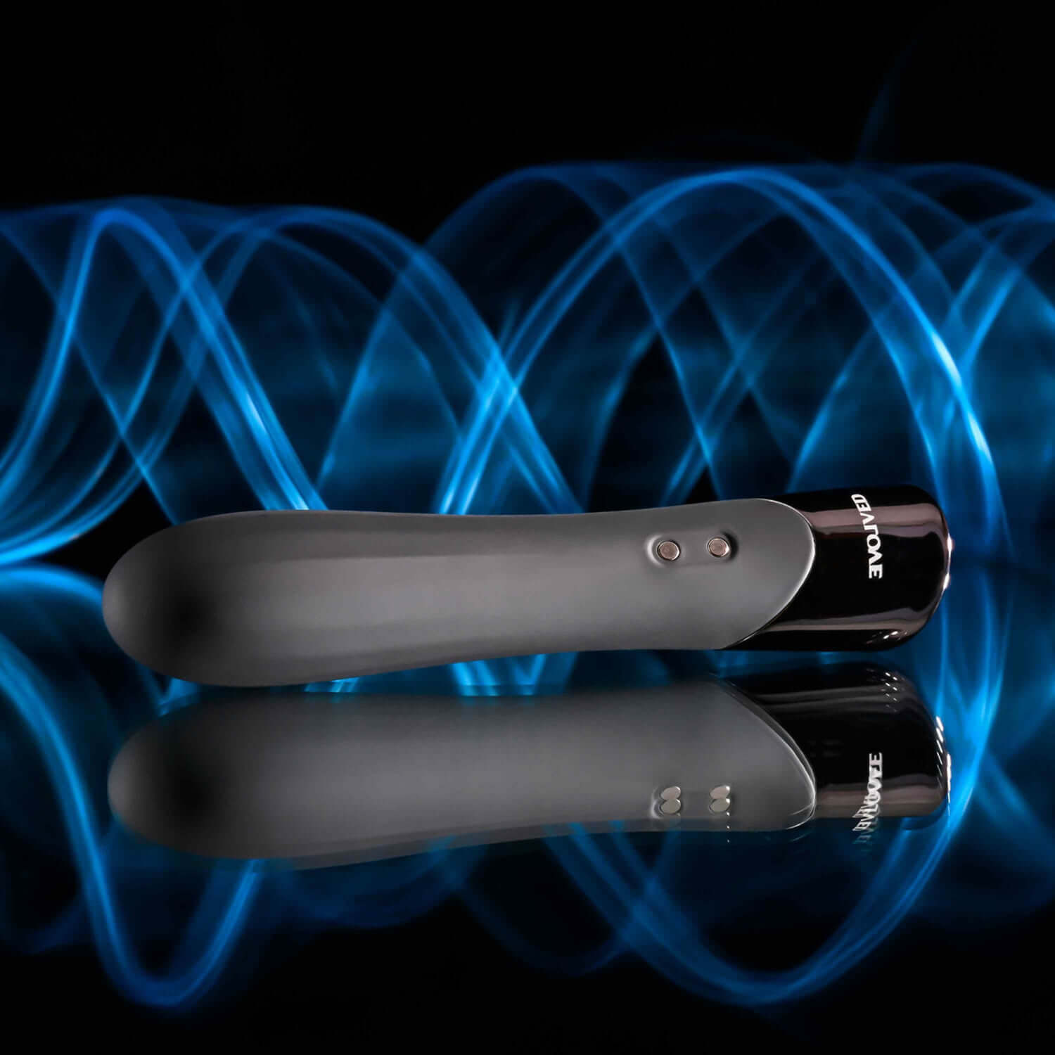 Sleek black vibrator with chrome tip, featuring textured shaft, one-button control, and a vibrant blue wave background.