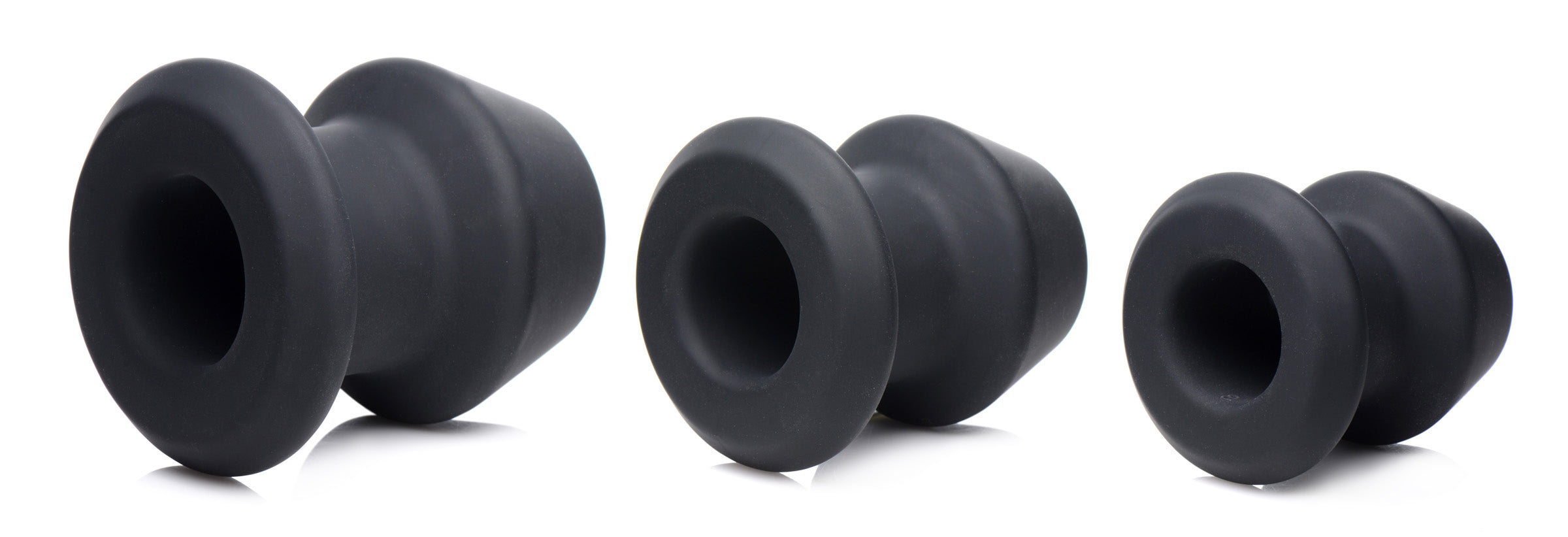 Gape-Grommets 3 Piece Hollow Silicone Anal Dilator Set featuring three progressively sized hollow dilators.