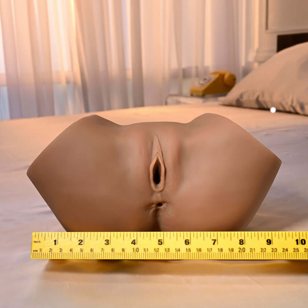 Squirt for Me Chanell Heart Movie & Realistic Squirting Stroker Dark featuring lifelike design on a bed.