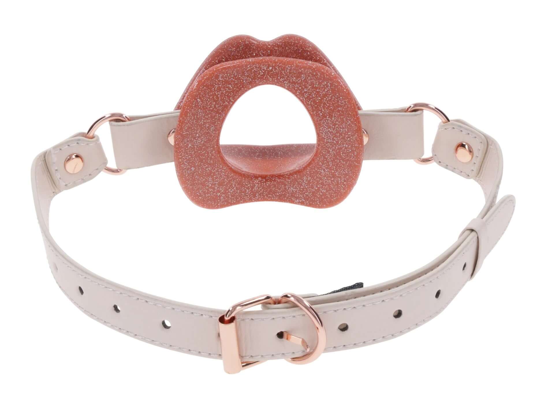 Peaches ‘N Creame silicone lips gag in pink with faux leather buckle strap on white background
