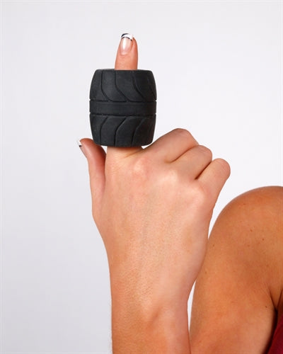 Perfect Fit Silaskin 2-Inch Ball Stretcher Black worn on a thumb, showcasing its unique design and comfort features.