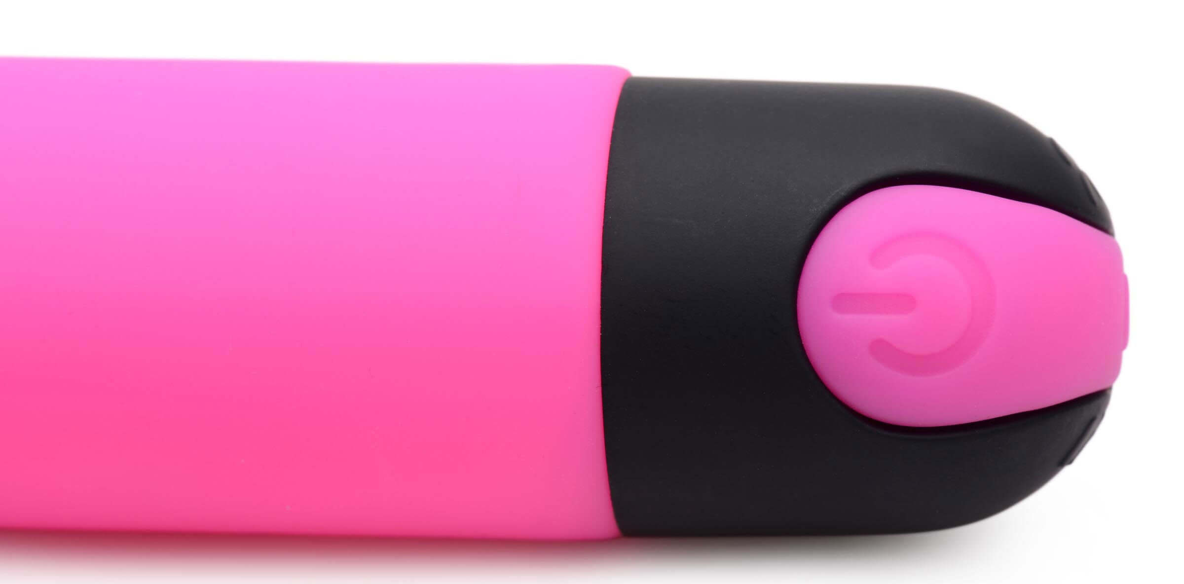Close-up of the Bang 10X Rechargeable Silicone G-Spot Vibrator Pink showing its power button and sleek design.