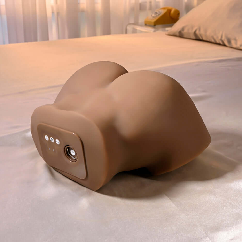 Squirt for Me Chanell Heart Movie & Realistic Squirting Stroker Dark on a bed with smooth fabric.