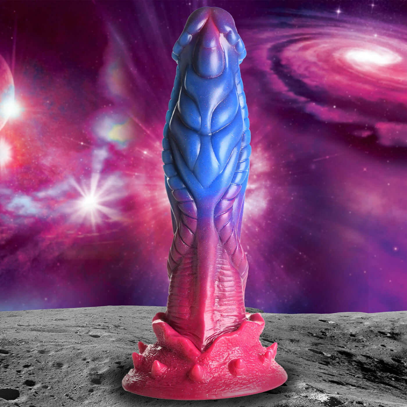 Blue and pink alien silicone dildo with cosmic background and glitter accents