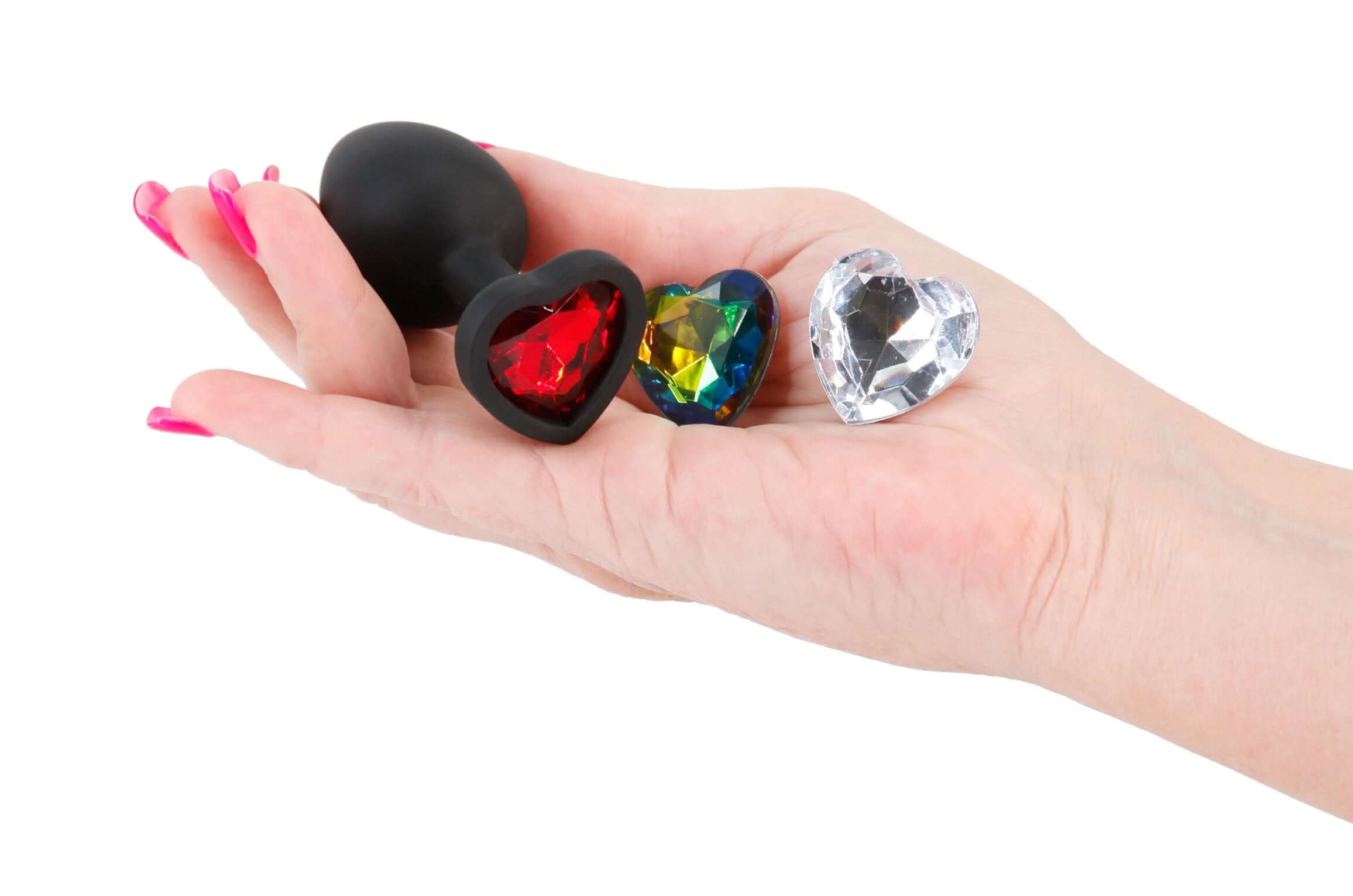 Glams Xchange Heart Small Butt Plug Black in hand, showcasing its elegant heart-shaped design and colorful gem accents.