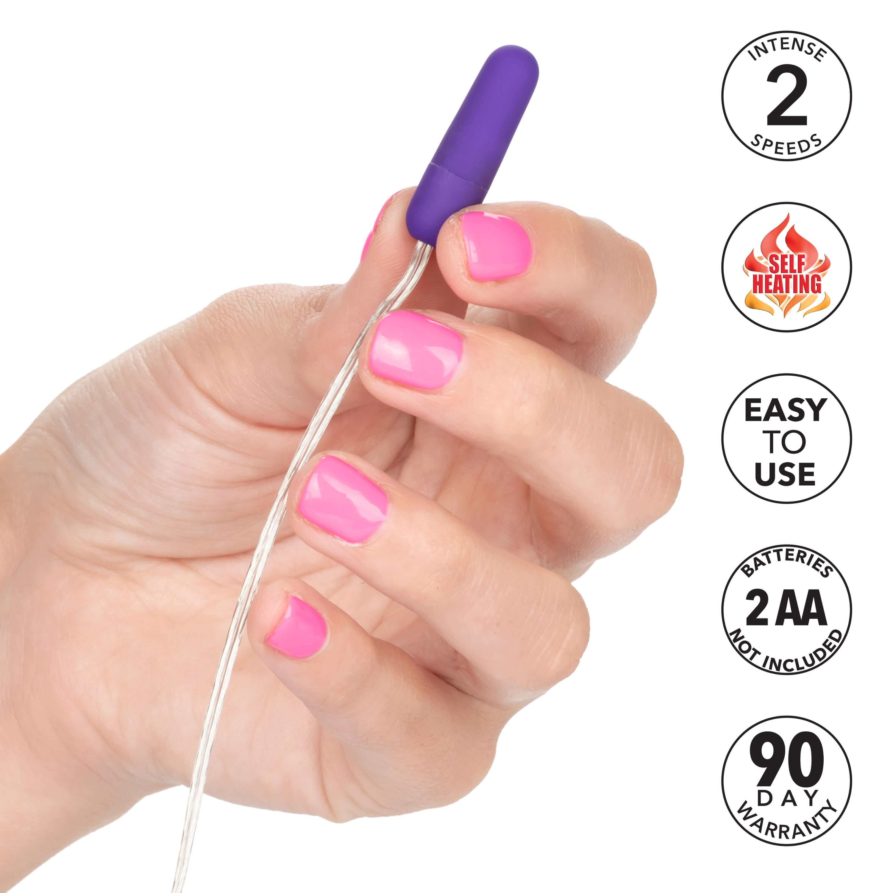 Whisper Micro Bullet Vibrator Purple held in hand, showcasing its compact size and features like self-heating and easy use.