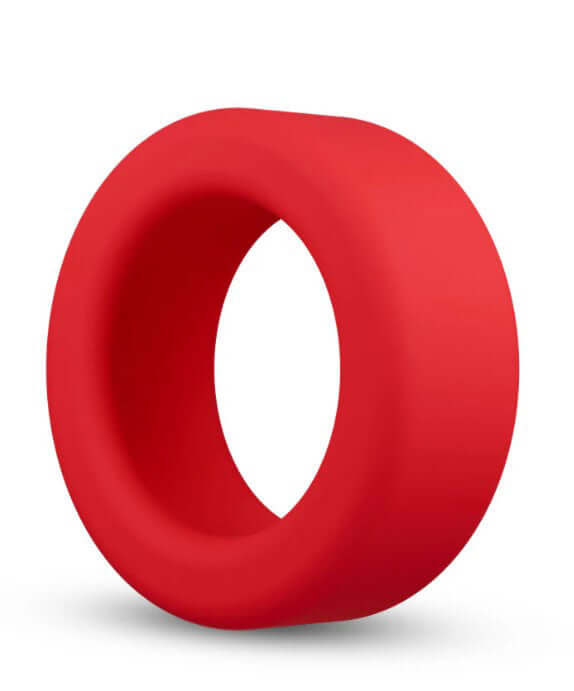 Performance Plus Pursuit Silicone Cock Ring Red displayed at an angle on a white background, showcasing its thick silicone construction.