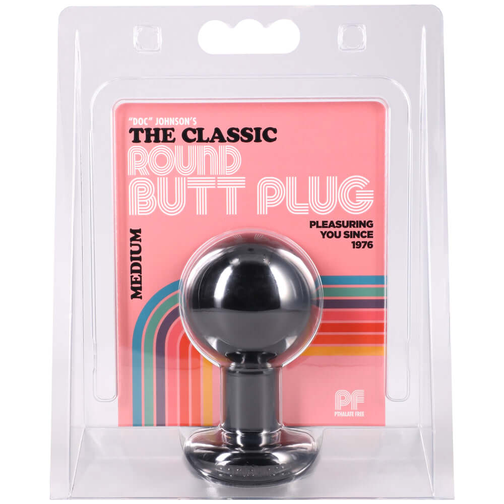 The Classic Round Butt Plug Medium Black in packaging with vibrant colors and smooth spherical design.