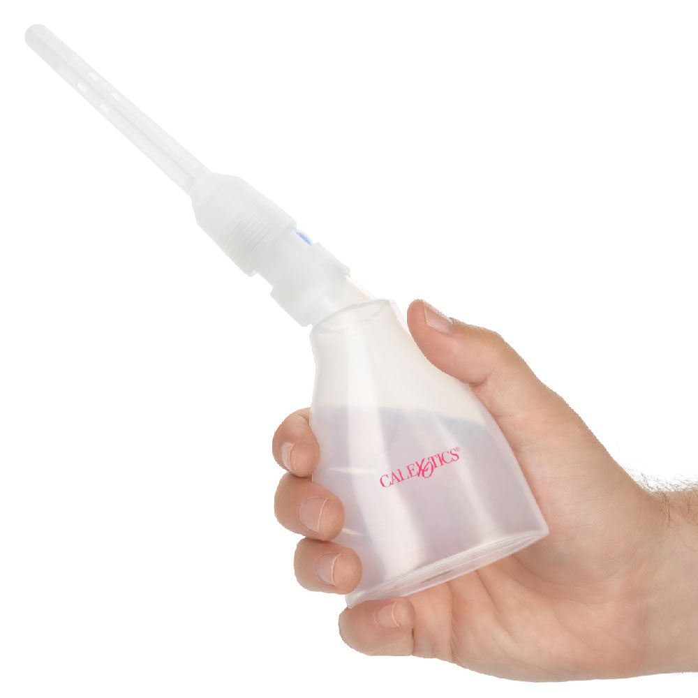 One-Way Ultimate Douche Clear held in hand, designed for comfort and hygiene with a one-way valve feature.